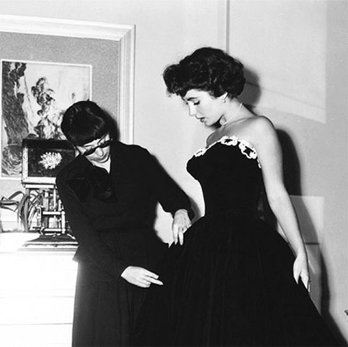 Edith Head with Elizabeth Taylor dressing her for A Place In The Sun