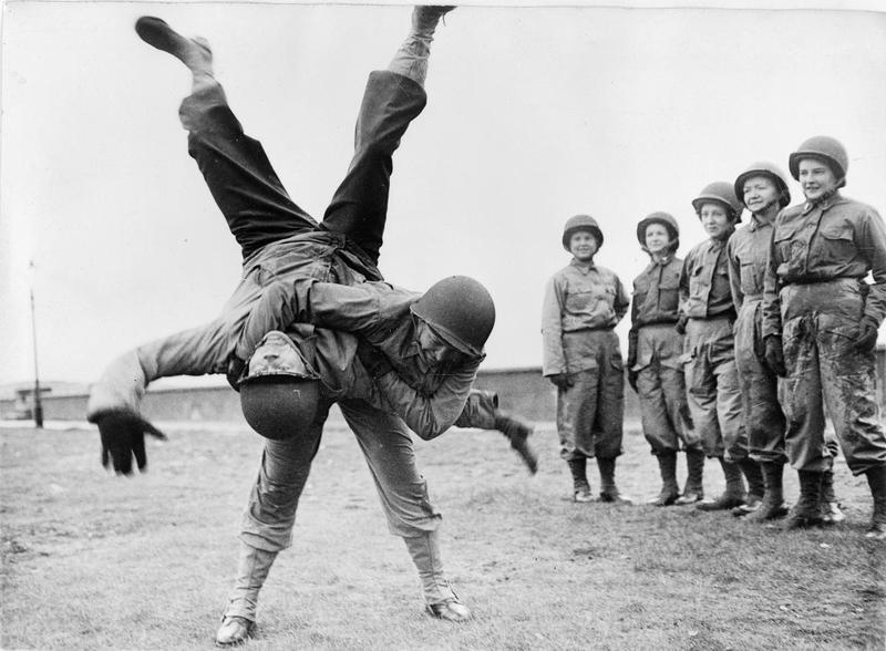 American army nurse during WW2 demonstrating Ju-Jitsu, the “gentle technique”. This Japanese martial art uses the opponent;s own strength against herself,